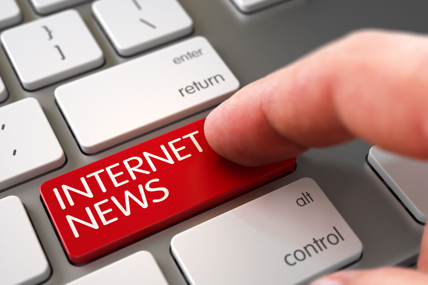 finger pressing a red button with the text "internet news"