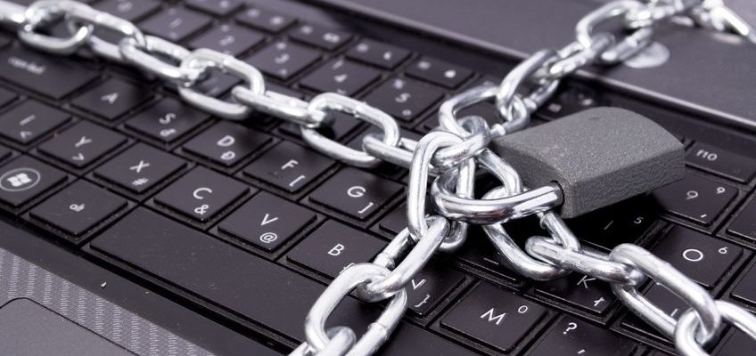 keyboard with heavy chains and padlock wrapped around it
